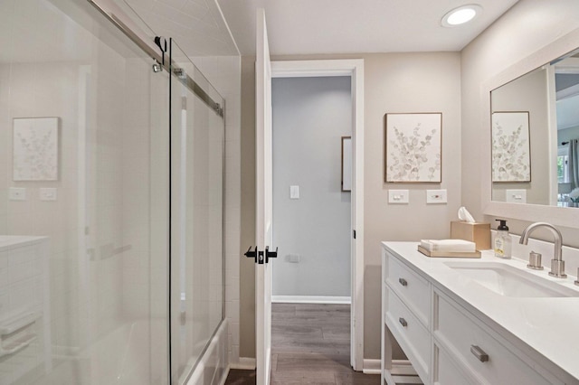 2720 Hobson Rd, Woodridge, IL 60517 - full bath with vanity, wood finished floors, and shower / bath combination with glass door