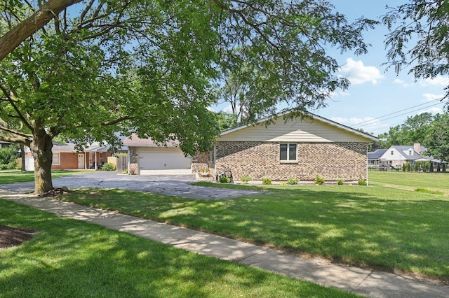 2720 Hobson Rd, Woodridge, IL 60517 - view of front facade featuring brick siding, a front yard, and driveway
