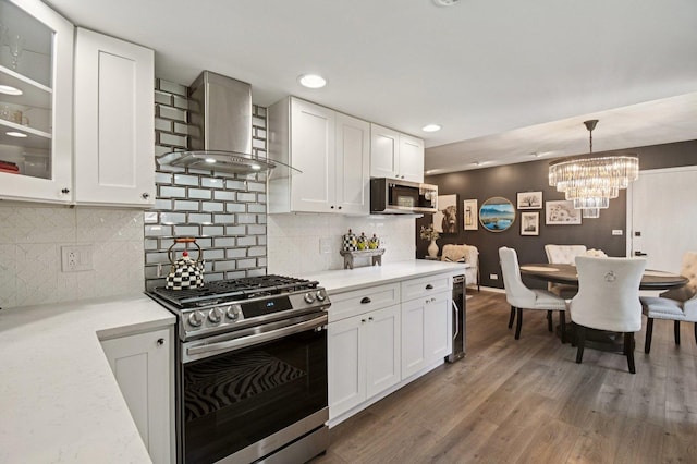 2720 Hobson Rd, Woodridge, IL 60517 - kitchen featuring stainless steel appliances, wall chimney exhaust hood, white cabinets, tasteful backsplash, and recessed lighting