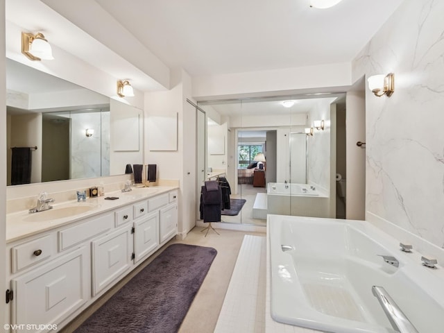 1671 Mission Hills Rd Unit 308, Northbrook, IL 60062 - ensuite bathroom featuring double vanity and a bath