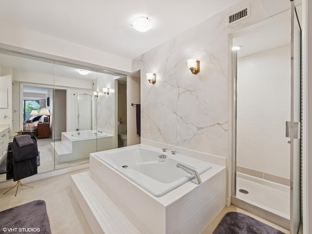 1671 Mission Hills Rd Unit 308, Northbrook, IL 60062 - ensuite bathroom with a bath, a stall shower, and vanity