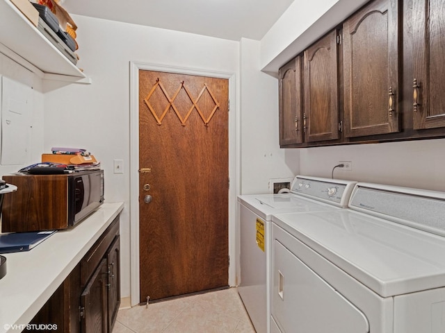 1671 Mission Hills Rd Unit 308, Northbrook, IL 60062 - laundry room featuring independent washer and dryer, light tile patterned floors, and cabinet space