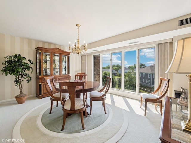1671 Mission Hills Rd Unit 308, Northbrook, IL 60062 - carpeted dining area featuring a chandelier and wallpapered walls