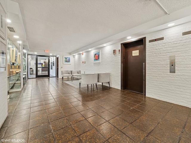 1671 Mission Hills Rd Unit 308, Northbrook, IL 60062 - building lobby with a textured ceiling and recessed lighting
