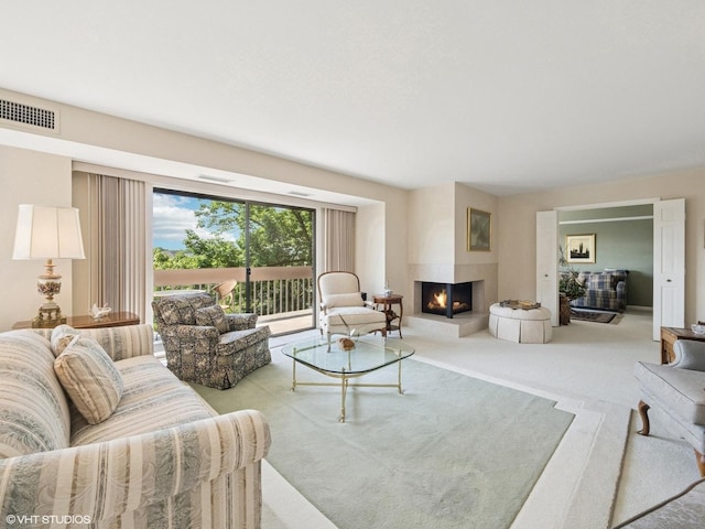 1671 Mission Hills Rd Unit 308, Northbrook, IL 60062 - carpeted living room featuring a multi sided fireplace