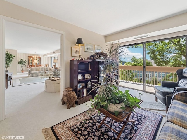 1671 Mission Hills Rd Unit 308, Northbrook, IL 60062 - carpeted living room with a chandelier