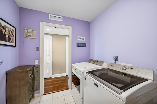 3470 N Lake Shore Dr Unit 9Bc, Chicago, IL 60657 - washroom featuring independent washer and dryer and light tile patterned flooring
