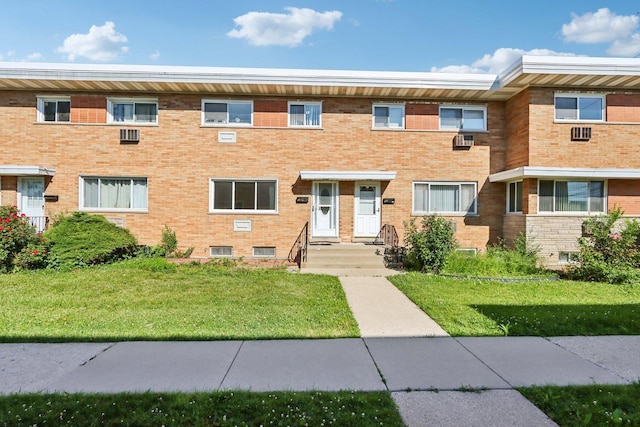 8666 Gregory Ln Unit C, Des Plaines, IL 60016 - townhome / multi-family property with a front lawn, brick siding, and cooling unit