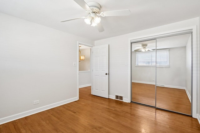 8666 Gregory Ln Unit C, Des Plaines, IL 60016 - unfurnished bedroom featuring wood finished floors, a closet, and ceiling fan