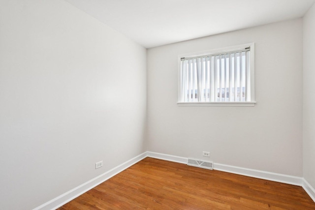 8666 Gregory Ln Unit C, Des Plaines, IL 60016 - empty room with baseboards and wood finished floors