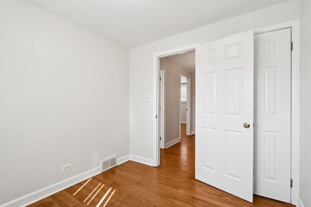 8666 Gregory Ln Unit C, Des Plaines, IL 60016 - empty room featuring baseboards and wood finished floors