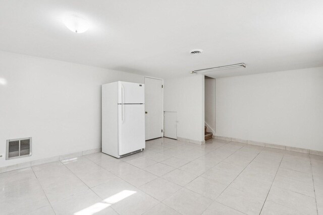 8666 Gregory Ln Unit C, Des Plaines, IL 60016 - unfurnished room with stairs and light tile patterned floors