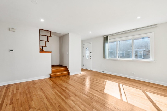 8666 Gregory Ln Unit C, Des Plaines, IL 60016 - empty room with stairway, light wood-style flooring, and recessed lighting