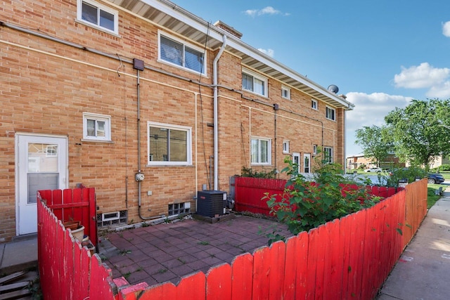 8666 Gregory Ln Unit C, Des Plaines, IL 60016 - view of side of property featuring brick siding and a patio area