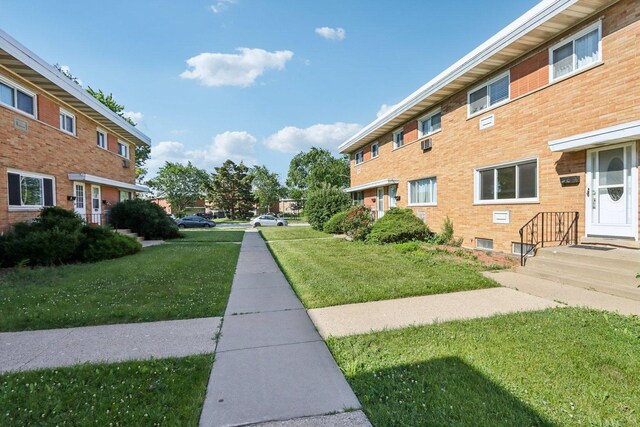 8666 Gregory Ln Unit C, Des Plaines, IL 60016 - view of property's community with a lawn
