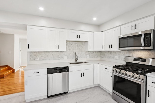 8666 Gregory Ln Unit C, Des Plaines, IL 60016 - kitchen with appliances with stainless steel finishes, light countertops, white cabinetry, tasteful backsplash, and recessed lighting