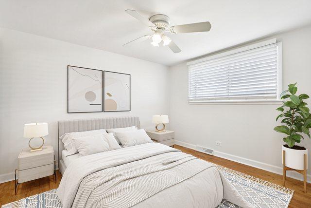 8666 Gregory Ln Unit C, Des Plaines, IL 60016 - bedroom featuring wood finished floors and ceiling fan