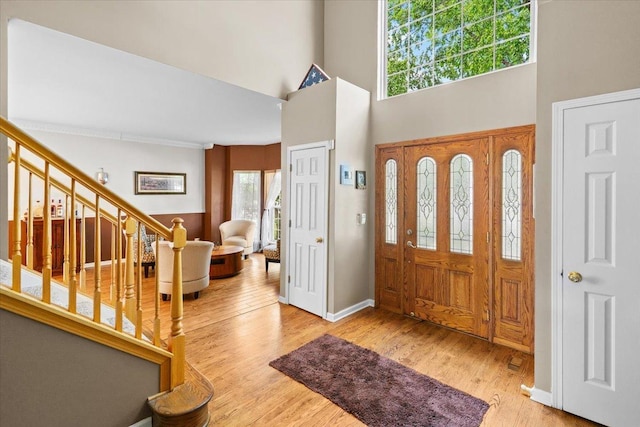 33 Sarah Dr, Crystal Lake, IL 60014 - entrance foyer featuring stairs, wood finished floors, and a high ceiling