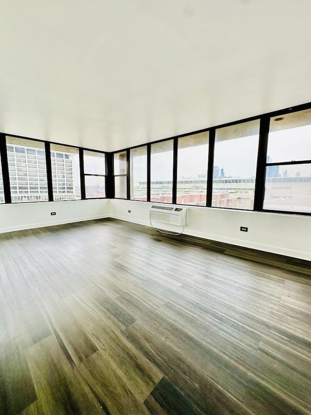 345 E Eastgate Pl Unit 602, Chicago, IL 60616 - empty room featuring a wall unit AC and baseboards