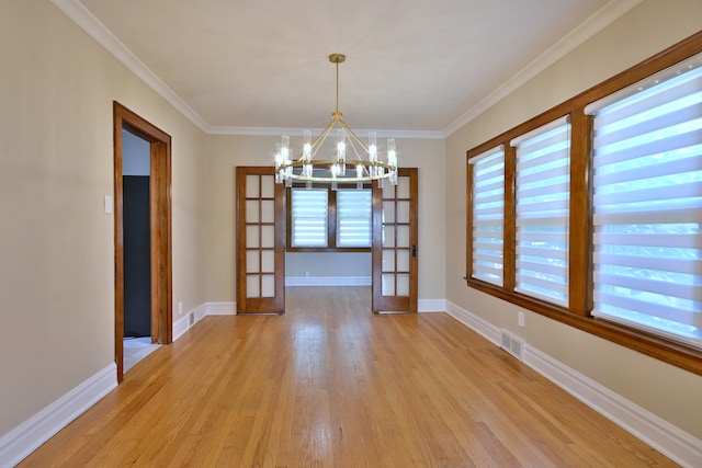 3218 Scoville Ave, Berwyn, IL 60402 - unfurnished dining area with a chandelier, light wood-style floors, french doors, and crown molding