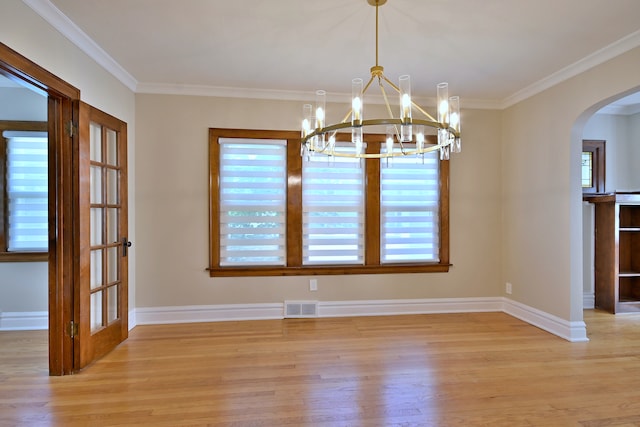 3218 Scoville Ave, Berwyn, IL 60402 - unfurnished dining area featuring arched walkways, light wood finished floors, a chandelier, and crown molding