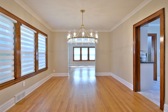 3218 Scoville Ave, Berwyn, IL 60402 - spare room with a chandelier, light wood finished floors, and crown molding