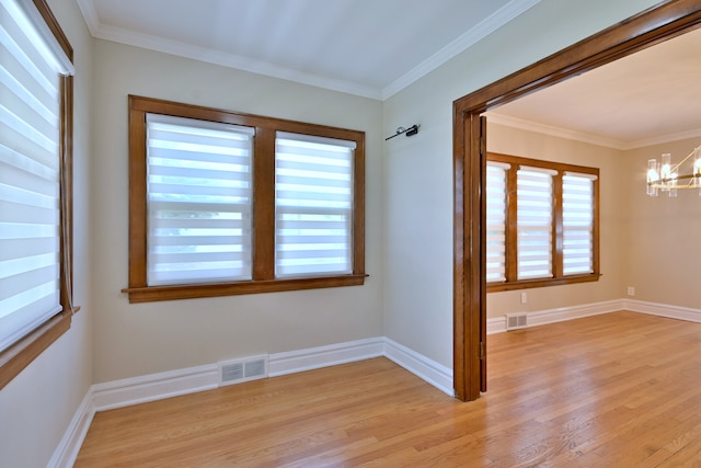 3218 Scoville Ave, Berwyn, IL 60402 - empty room with a chandelier, light wood-style floors, and ornamental molding