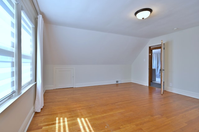 3218 Scoville Ave, Berwyn, IL 60402 - additional living space with lofted ceiling, light wood-style floors, and healthy amount of natural light