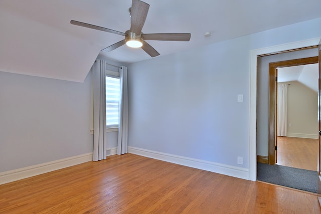 3218 Scoville Ave, Berwyn, IL 60402 - unfurnished room featuring vaulted ceiling, a ceiling fan, and light wood finished floors