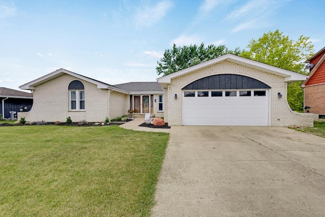 1205 Shagbark Rd, New Lenox, IL 60451 - view of front of house with brick siding, a front lawn, and driveway