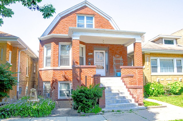 4048 N Marmora Ave, Chicago, IL 60630 - dutch colonial featuring brick siding and a gambrel roof