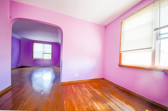 4048 N Marmora Ave, Chicago, IL 60630 - spare room with arched walkways and wood finished floors