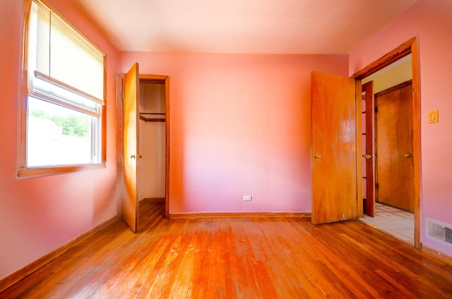 4048 N Marmora Ave, Chicago, IL 60630 - unfurnished bedroom with light wood finished floors and baseboards