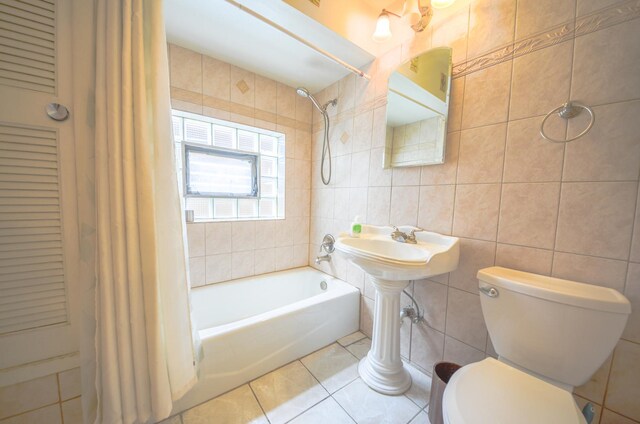 4048 N Marmora Ave, Chicago, IL 60630 - bathroom with tile walls, shower / tub combo, and tile patterned flooring