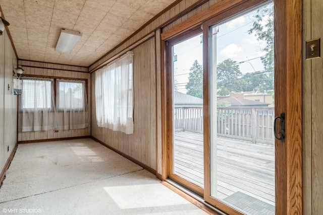 6919 N Overhill Ave, Chicago, IL 60631 - unfurnished sunroom with wooden walls and carpet flooring
