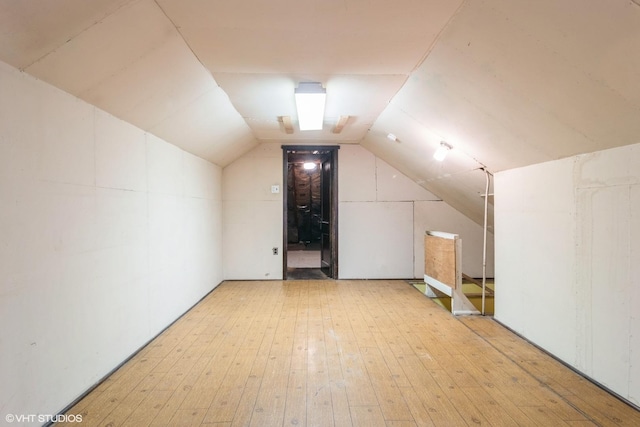 6919 N Overhill Ave, Chicago, IL 60631 - additional living space with light wood-style floors and lofted ceiling