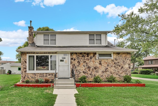 23761 N Cottage Rd, Lake Zurich, IL 60047 - view of front of house featuring stone siding, a front lawn, and a chimney