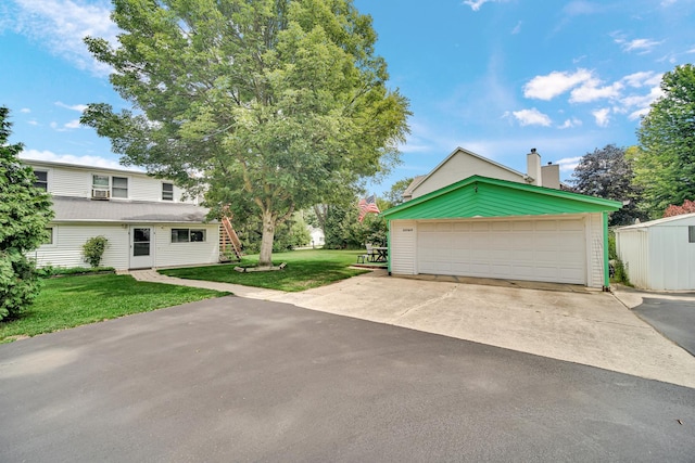 23761 N Cottage Rd, Lake Zurich, IL 60047 - view of front of house with an outbuilding, a front yard, a chimney, and a garage