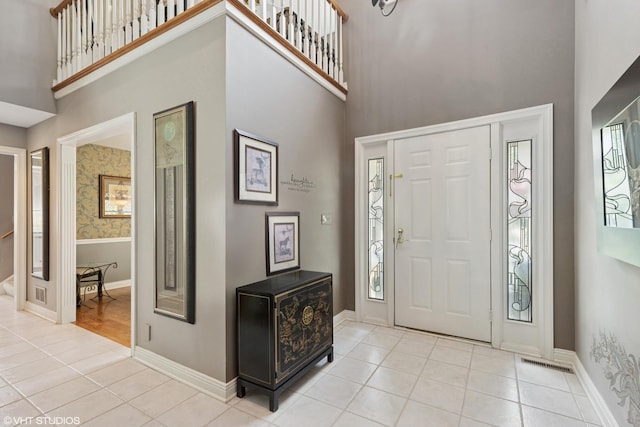 1806 Princeton Ct, Lake Forest, IL 60045 - entrance foyer featuring a towering ceiling, tile patterned floors, and healthy amount of natural light