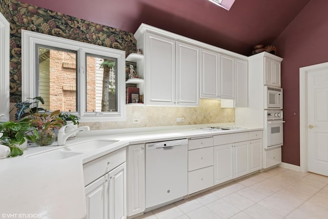1806 Princeton Ct, Lake Forest, IL 60045 - kitchen featuring white appliances, light countertops, white cabinetry, and light tile patterned floors