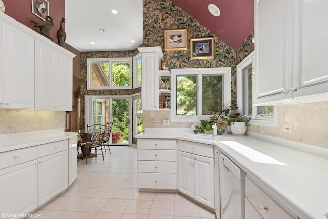 1806 Princeton Ct, Lake Forest, IL 60045 - kitchen featuring white dishwasher, tasteful backsplash, healthy amount of natural light, vaulted ceiling, and wallpapered walls