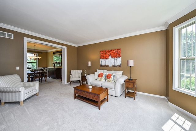 520 Meadowwood Ln, Oswego, IL 60543 - living room with ornamental molding, healthy amount of natural light, light carpet, and a chandelier