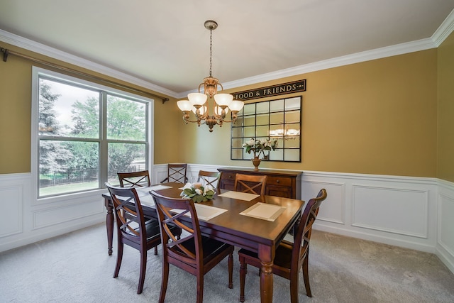 520 Meadowwood Ln, Oswego, IL 60543 - dining room with light colored carpet, a chandelier, wainscoting, a decorative wall, and crown molding