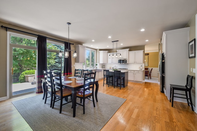 520 Meadowwood Ln, Oswego, IL 60543 - dining space featuring light wood-style floors and recessed lighting