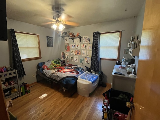 224 S Prairie Ave, Bradley, IL 60915 - bedroom featuring wood finished floors, multiple windows, and a ceiling fan