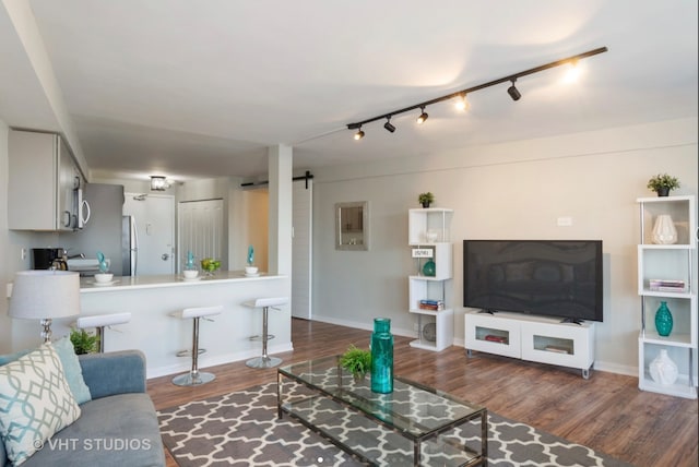 300 N State St Unit 3808, Chicago, IL 60654 - living area featuring wood finished floors, a barn door, and track lighting