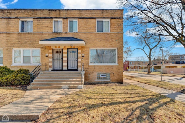 8559 S Drexel Ave, Chicago, IL 60619 - view of property featuring brick siding and a front lawn