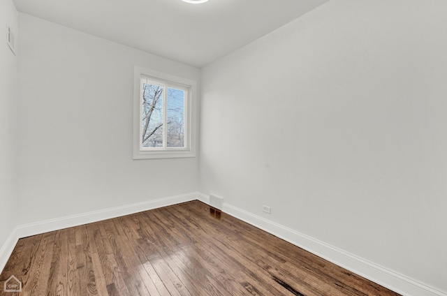 8559 S Drexel Ave, Chicago, IL 60619 - unfurnished room with baseboards and dark wood-style floors