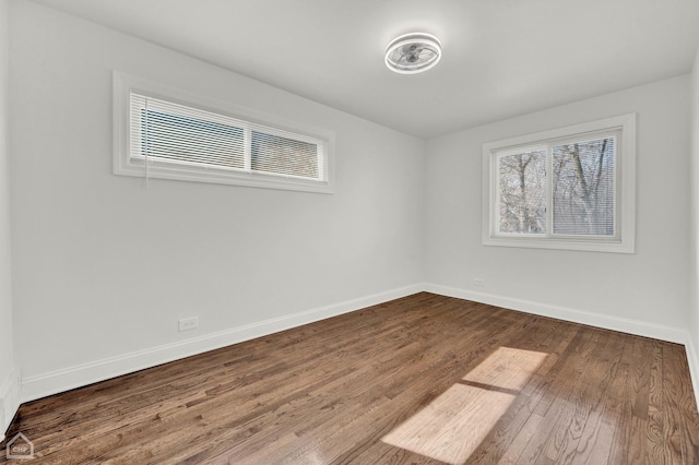 8559 S Drexel Ave, Chicago, IL 60619 - spare room with dark wood-style floors and baseboards
