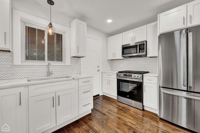 8559 S Drexel Ave, Chicago, IL 60619 - kitchen with stainless steel appliances, backsplash, white cabinetry, decorative light fixtures, and recessed lighting